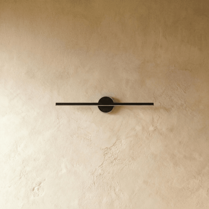 Nyxtra Wall Lamp by Residence Supply featuring a sleek modern design with a metal finish and adjustable arm for versatile lighting.