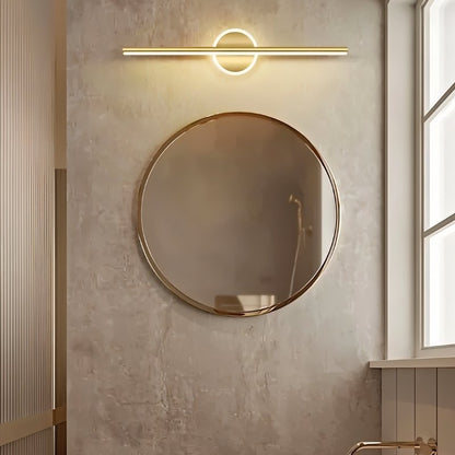 Modern gold Nyxtra Wall Lamp by Residence Supply, mounted above a bathroom vanity with sleek, contemporary design.