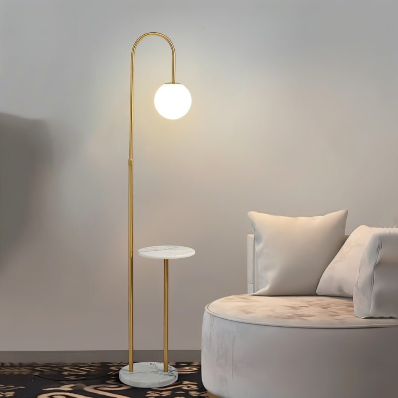 Okul floor lamp with smart side table by Residence Supply featuring a modern design, integrated lighting, and a sleek wooden surface.