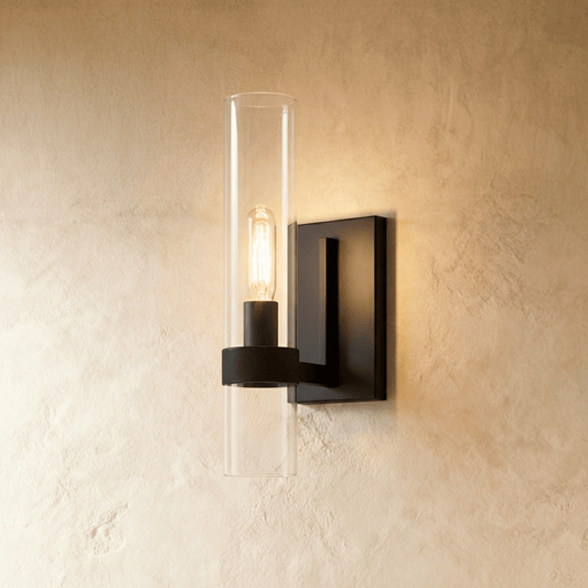 Oraya Wall Lamp by Residence Supply featuring a sleek modern design with a cylindrical shade and wall mounting bracket.