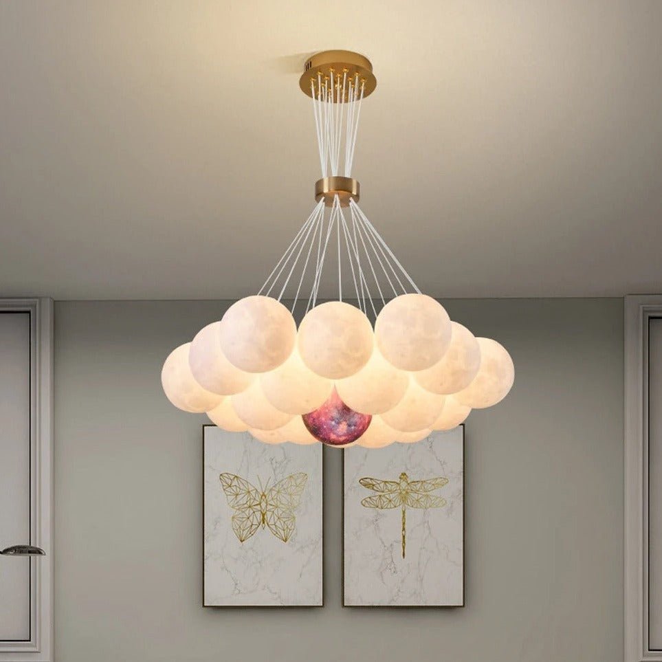 Orbea Chandelier by Residence Supply, elegant multi-arm lighting fixture with crystal accents, hanging from a ceiling.