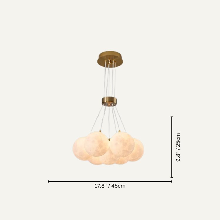 Orbea chandelier by Residence Supply featuring elegant pendant lights with a modern design and intricate metal detailing.