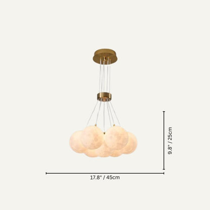 Orbea chandelier by Residence Supply featuring elegant pendant lights with a modern design and intricate metal detailing.