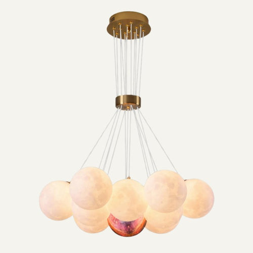 Orbea chandelier by Residence Supply featuring multiple hanging glass shades and a modern metal frame.