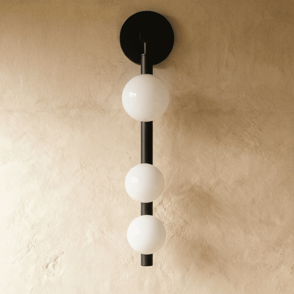 Residence Supply Orbos Wall Lamp with sleek modern design and brushed metal finish mounted on a wall.