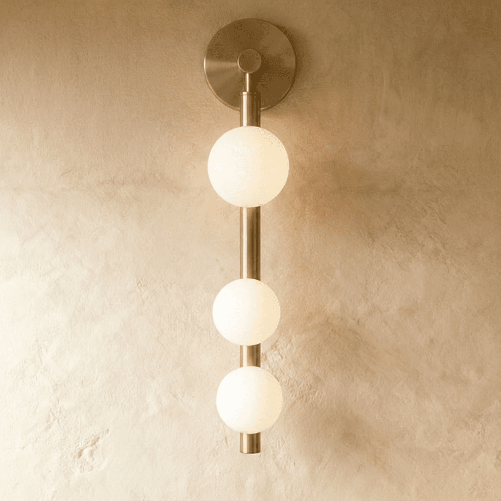 Modern Orbos Wall Lamp by Residence Supply with sleek design and ambient lighting, perfect for contemporary interior decor.