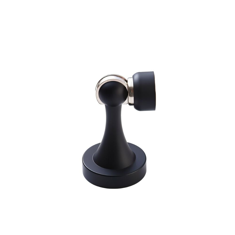 Residence Supply Osta Door Stop in black, mounted on a door to prevent slamming, ideal for home and garden door hardware.