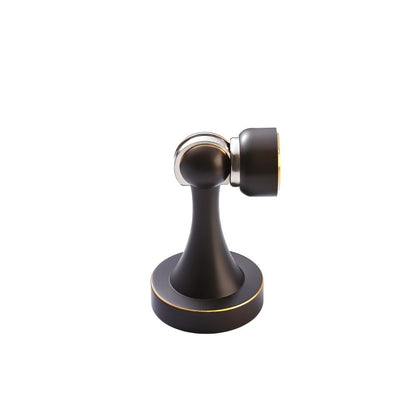Residence Supply Osta Door Stop in brass finish, mounted on a door to prevent it from closing fully.