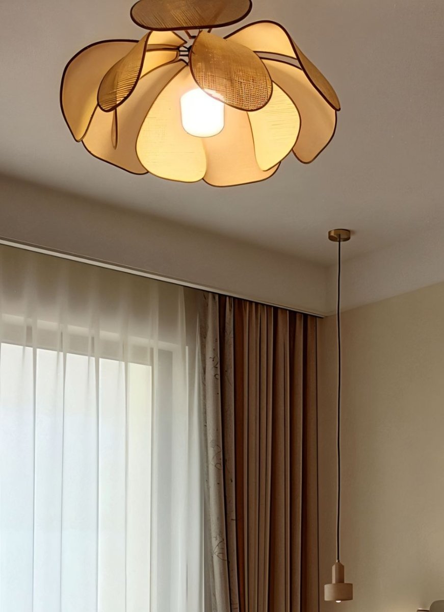 Elegant Pankh ceiling light fixture by Residence Supply with intricate feather design and warm lighting for stylish interior decor.