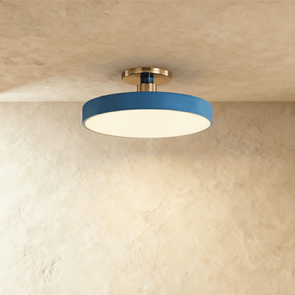 Modern Pentra ceiling light by Residence Supply with a sleek, round design and glass diffuser for ambient indoor lighting.