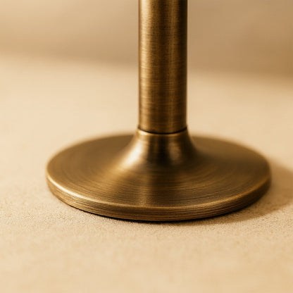 Open-box Residence Supply Pesu door stop in a home interior, designed to prevent door movement and protect walls.