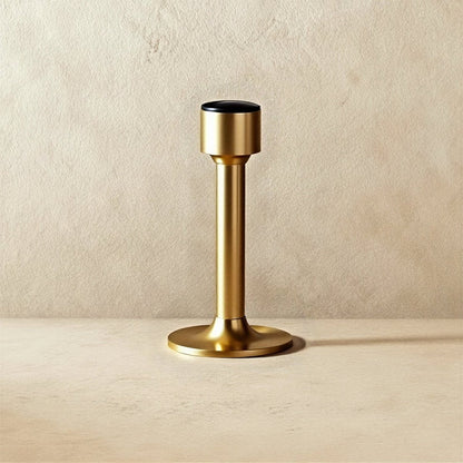 Open-box Pesu door stop by Residence Supply, mounted on door to prevent movement, in a home hardware setting.