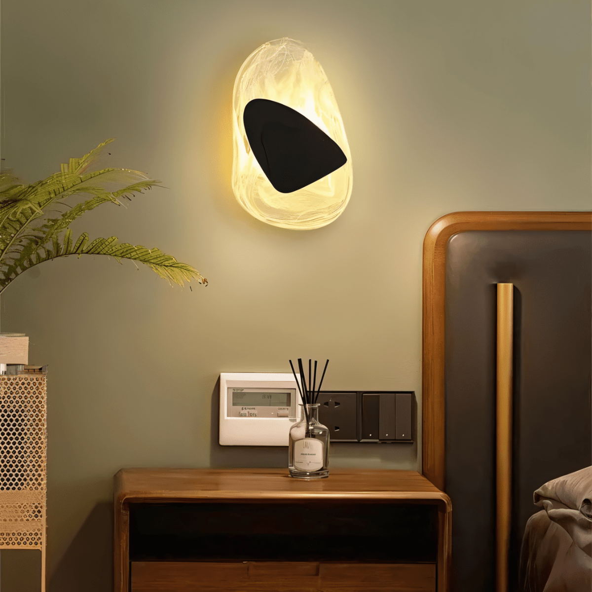 Residence Supply Petra Wall Lamp showing a modern design with a sleek metal finish and a mounted wall fixture.