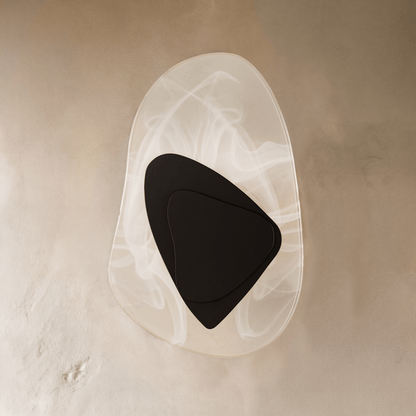 Residence Supply Petra Wall Lamp with sleek metal finish and modern design, mounted on a wall in a stylish interior setting.