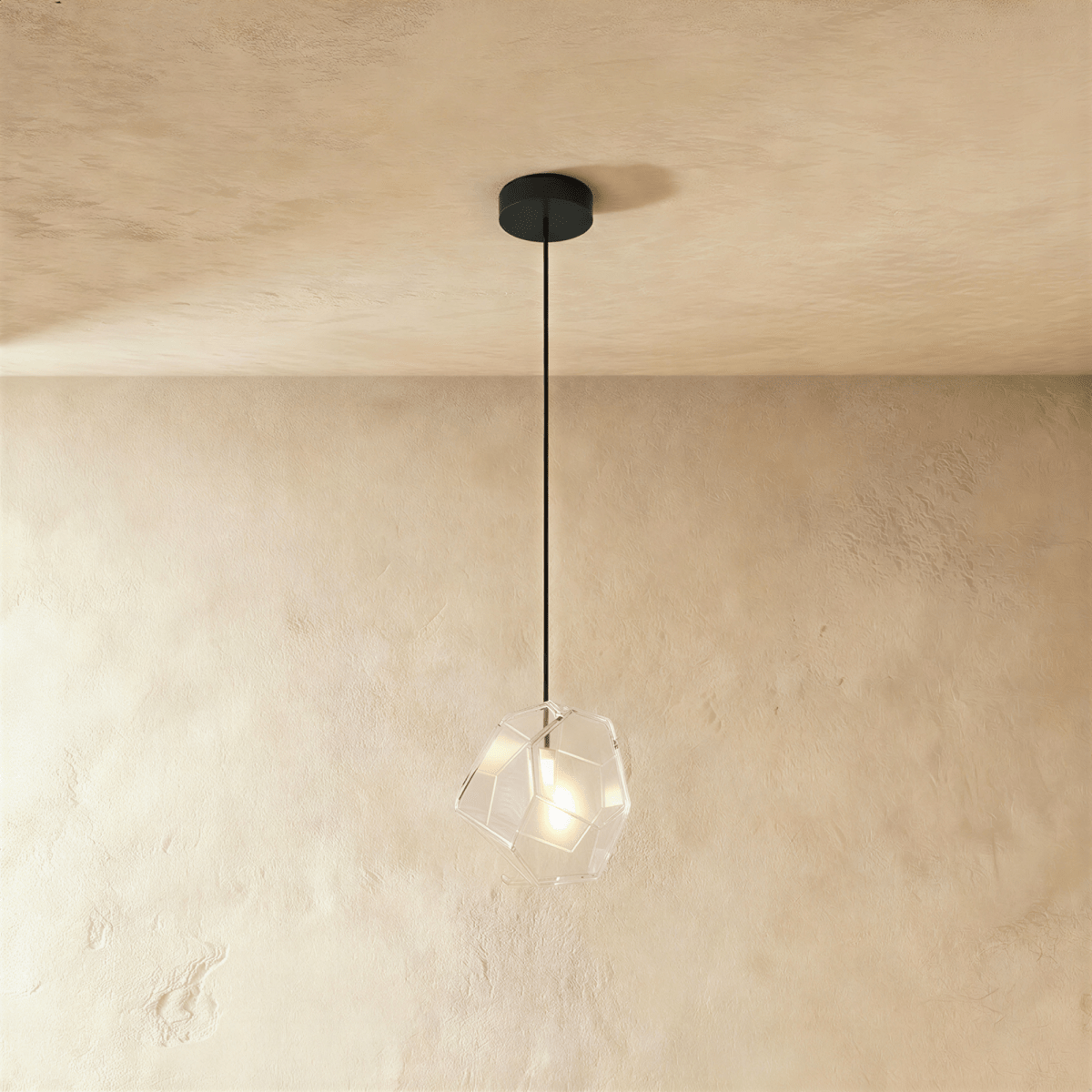 Residence Supply Piedra Pendant Light hanging fixture with a sleek, modern design and a textured stone-like finish.