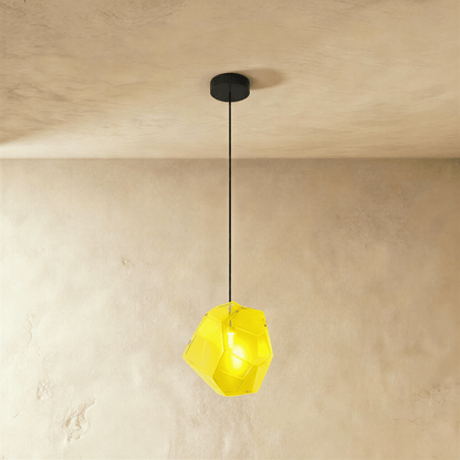 Residence Supply Piedra Pendant Light hanging with a modern design, featuring a sleek stone finish and warm ambient lighting.