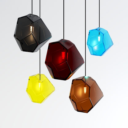 Residence Supply Piedra Pendant Light showing a sleek, modern hanging fixture with a stone-inspired design and warm lighting.