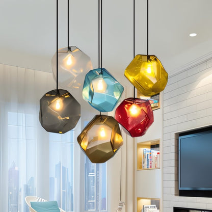 Piedra Pendant Light by Residence Supply featuring a modern, textured stone-inspired design hanging from a ceiling mount.