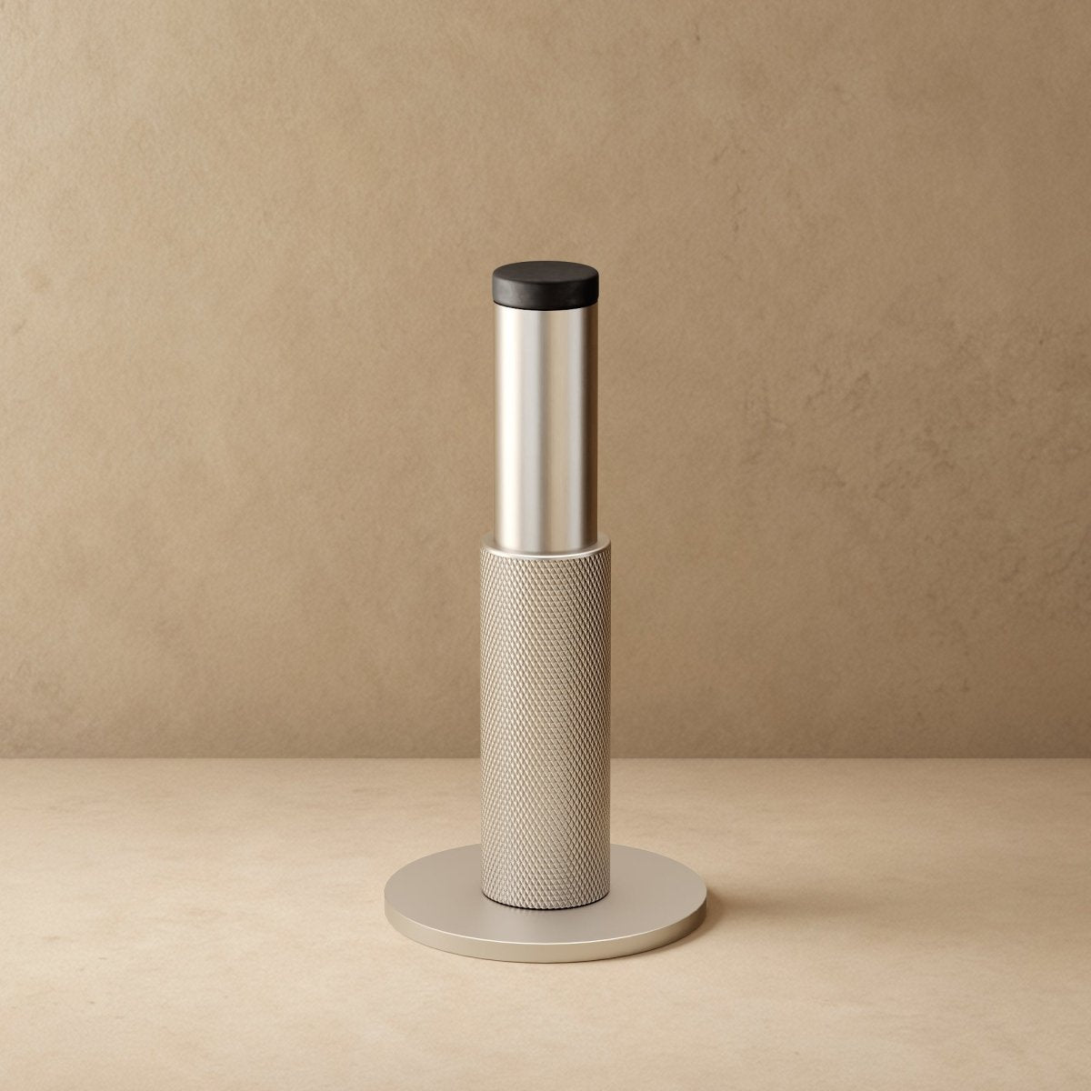Residence Supply Plint Door Stop securing a door, made of durable material with a sleek design for floor mounting.