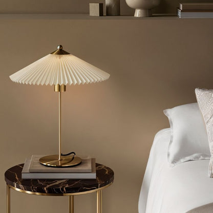 Plisse Table Lamp by Residence Supply featuring a pleated fabric shade and modern design on a wooden base.