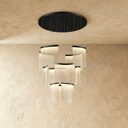 Primus Chandelier by Residence Supply featuring multiple glass pendant lights and a sleek modern metal frame.