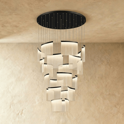 Elegant Primus chandelier by Residence Supply with multiple glass crystal tiers and a sleek metal frame, perfect for modern dining rooms.