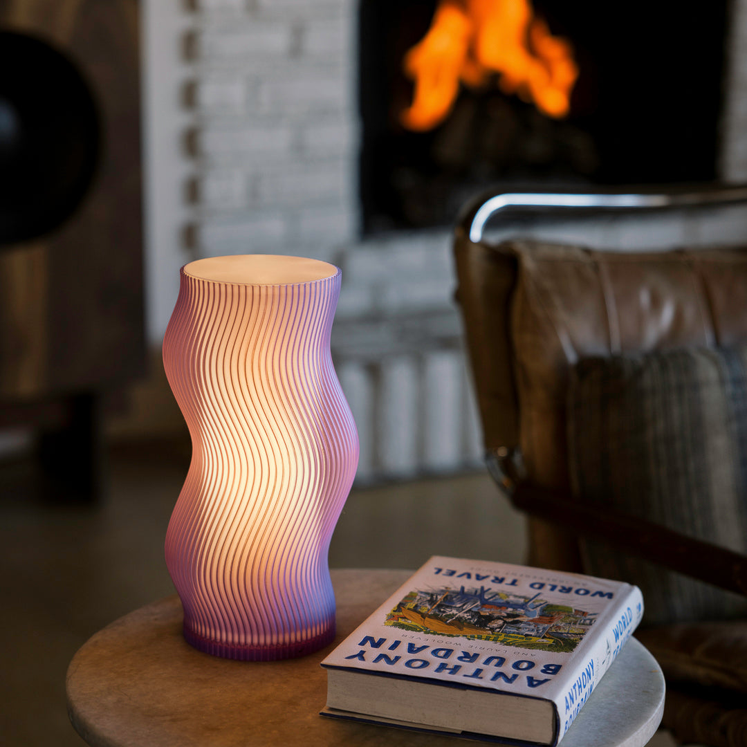 Terra Labs Woogie Table Lamp in purple with a rounded, modern design, perfect for adding stylish lighting to any space.