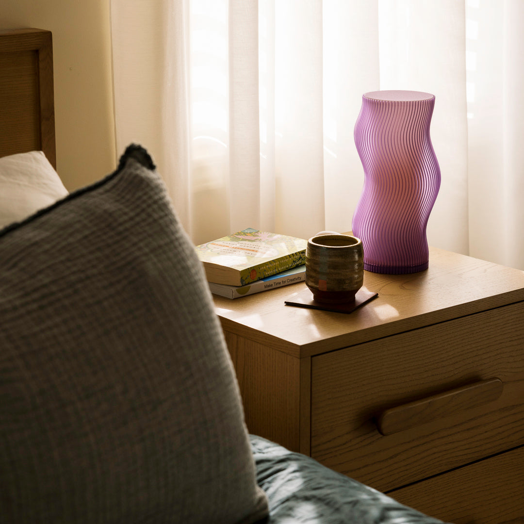 Terra Labs Woogie Table Lamp in purple with a playful, modern design and soft glowing light.