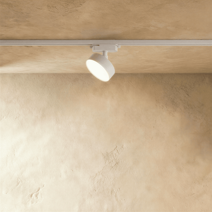 Residences Supply Quinn track lighting system with adjustable spotlights on a sleek metal track for modern interior lighting.