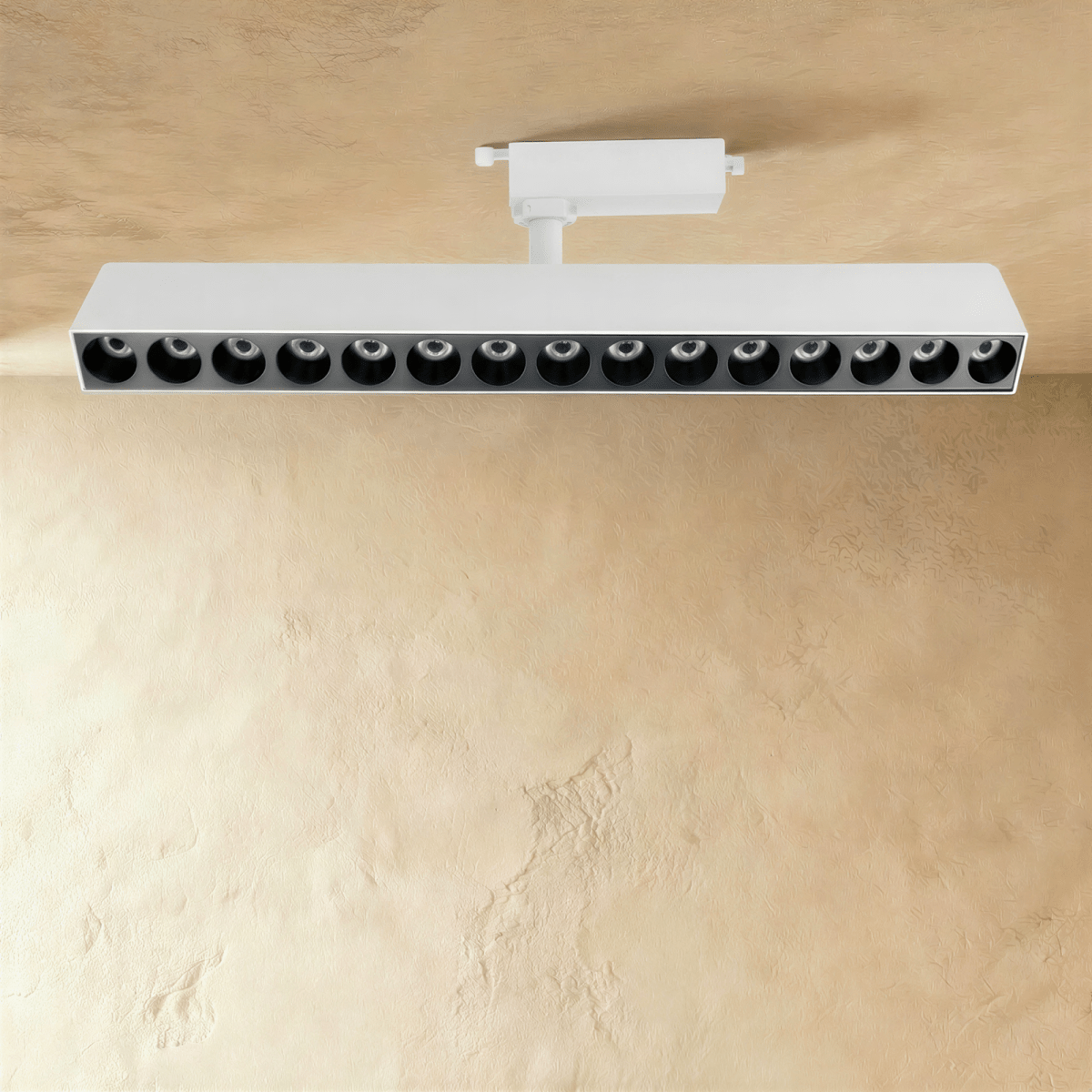 Modern Quinn Track Light System by Residence Supply with adjustable spotlights on a sleek track for versatile lighting.