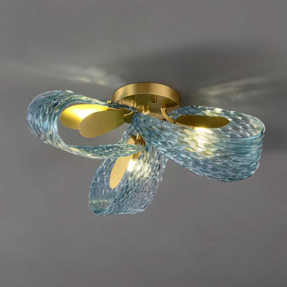 Modern Radiantia ceiling light by Residence Supply featuring a sleek, stylish design with a glowing central fixture and a contemporary finish.