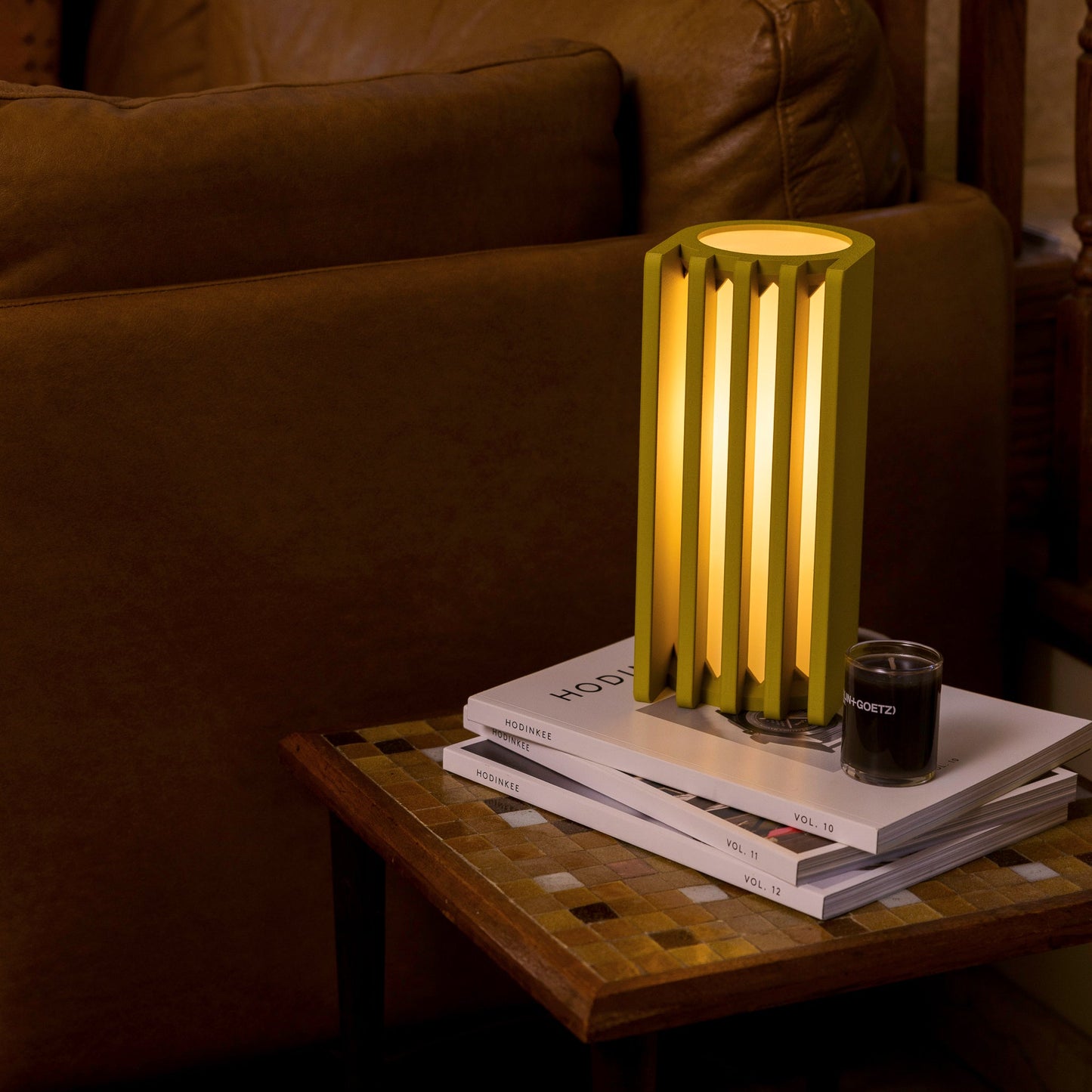 Mustard-colored Terra Labs radiator-inspired table lamp with a sleek, modern design and cylindrical shape.