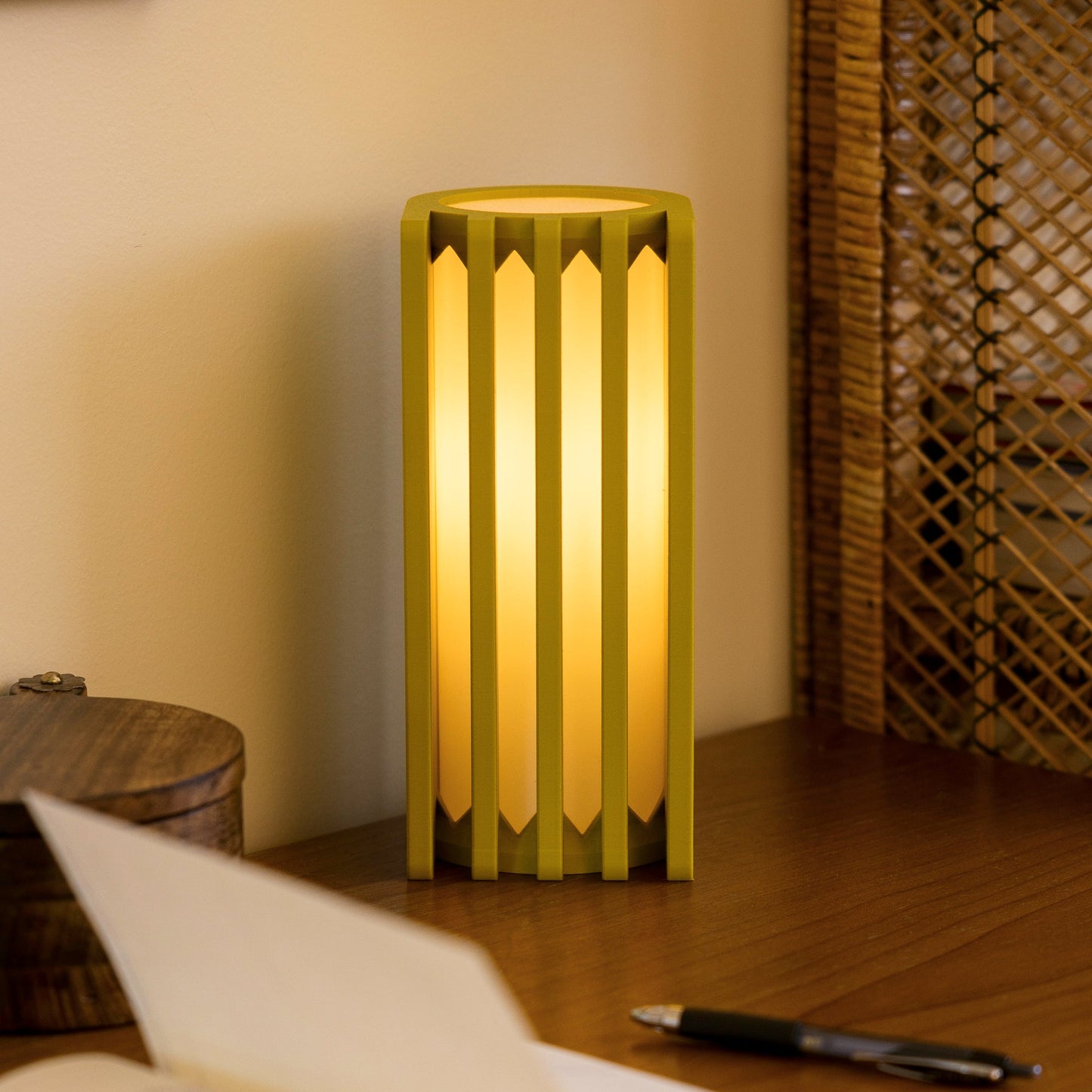 Terra Labs radiator-inspired mustard yellow table lamp with a sleek modern design on a wooden surface.