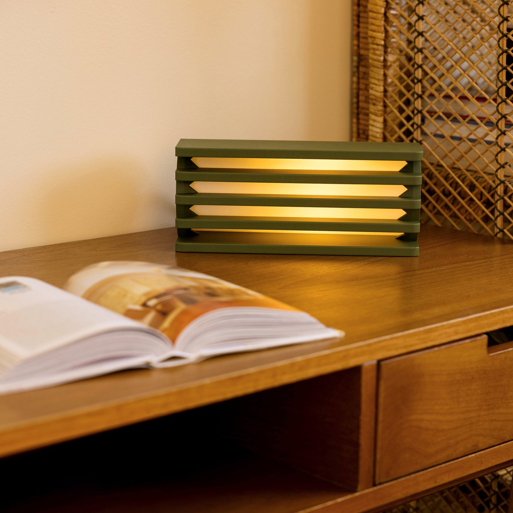 Terra Labs radiator table lamp with a sleek olive-colored radiator design and a modern base, ideal for contemporary home decor.