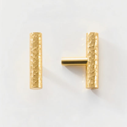 Hammered brass Remy knob and pull bar set from Residence Supply, featuring a stylish hardware design for cabinets.