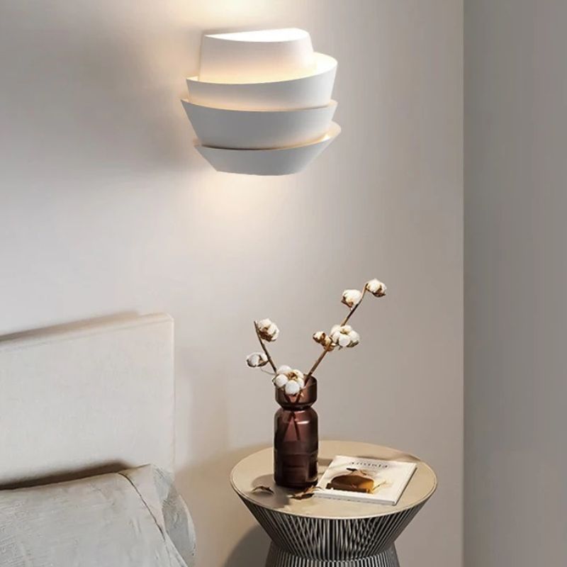 Residence Supply Rigno Wall Lamp showing sleek, modern design with a metal finish and mounted on a wall.
