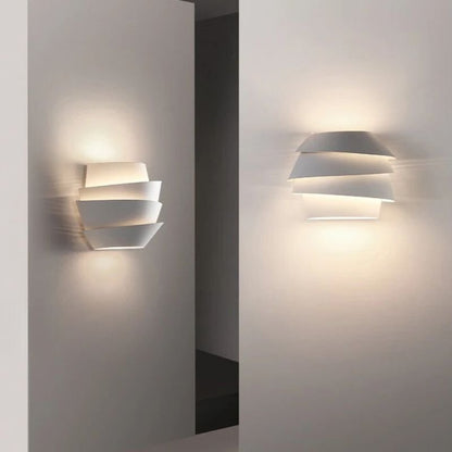 Rigno Wall Lamp by Residence Supply featuring a sleek modern design with a metallic finish and adjustable arm.