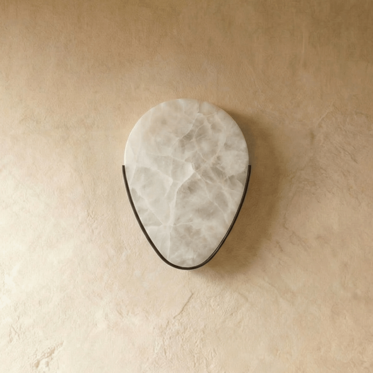Alabaster wall sconce by Residence Supply featuring a sleek, modern design with a warm glow and elegant finish.
