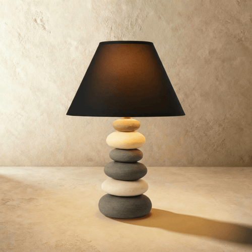 Rocky table lamp with a textured stone-like base and cylindrical fabric shade, perfect for modern home decor.