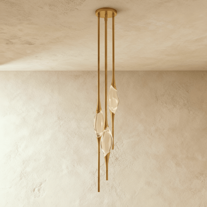 Romilly Pendant Light by Residence Supply hanging from ceiling with a sleek modern design and warm lighting.
