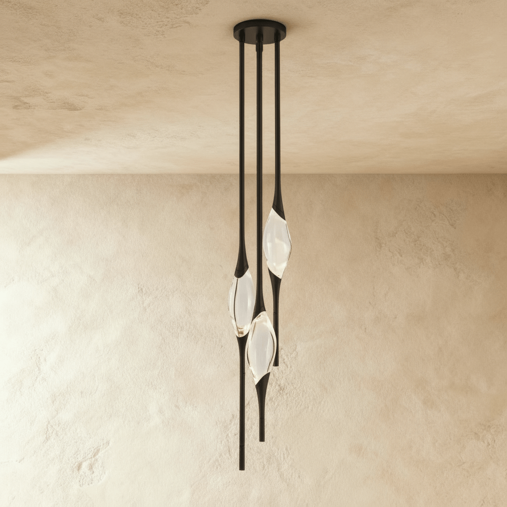 Romilly pendant light by Residence Supply featuring a sleek modern design with a metal finish and hanging cord.