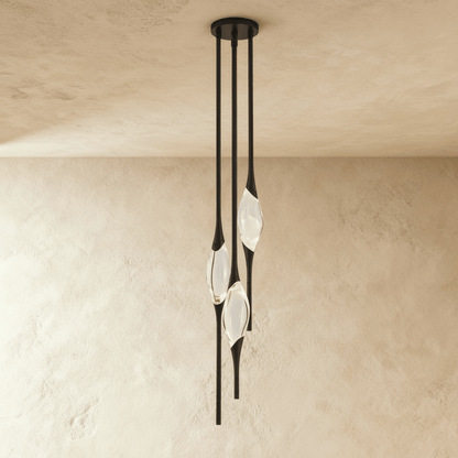 Romilly pendant light by Residence Supply featuring a sleek modern design with a metal finish and hanging cord.