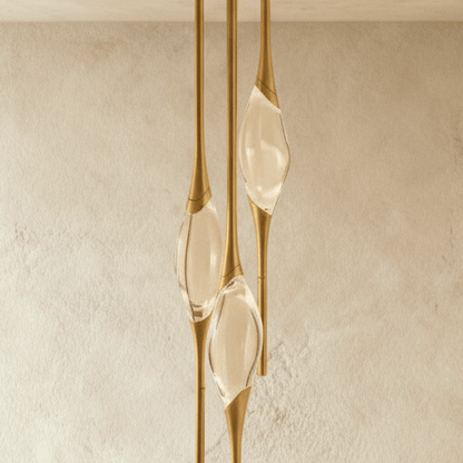 Romilly Pendant Light by Residence Supply featuring a sleek modern design with a metal finish and clear glass shade.