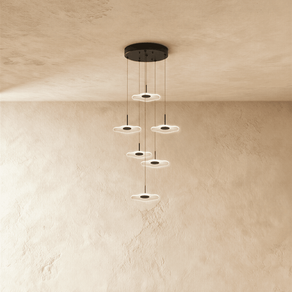 Modern Rotasu Staircase Chandelier by Residence Supply with multiple glass bulbs and sleek metal frame for elegant stairway lighting.