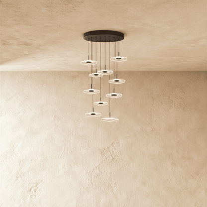 Rotasu Staircase Chandelier by Residence Supply featuring a modern, multi-tiered design with hanging glass orbs and metal frame.
