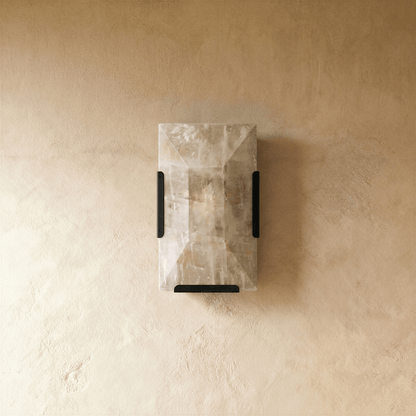 Sakhra Wall Lamp by Residence Supply, featuring a modern design with a textured stone finish and metal mounting bracket.