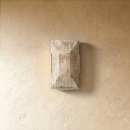 Sakhra Wall Lamp by Residence Supply featuring a rustic metal design with a warm glow for indoor or outdoor use