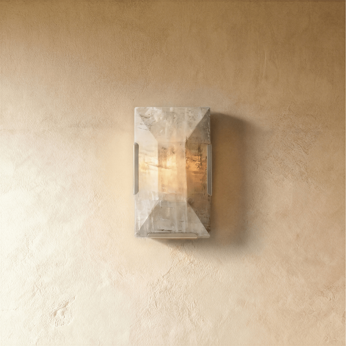 Sakhra Wall Lamp by Residence Supply featuring a modern, textured ceramic design with warm lighting for indoor wall decor