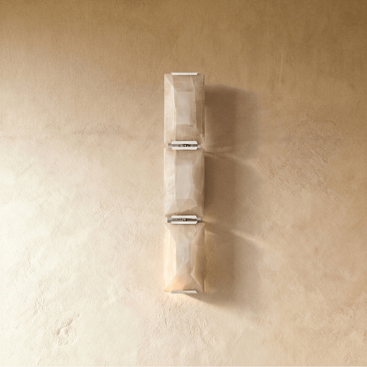 Sakhra Wall Lamp by Residence Supply showcasing an elegant wall-mounted fixture with a textured, sculptural design in a neutral finish.
