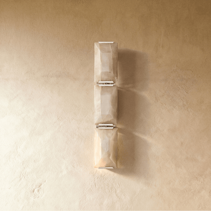 Sakhra Wall Lamp by Residence Supply showcasing an elegant wall-mounted fixture with a textured, sculptural design in a neutral finish.